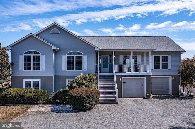 3 Ingram Bay Dr, Heathsville, VA 22473 - view of front of house with driveway, covered porch, stairway, stucco siding, and a garage