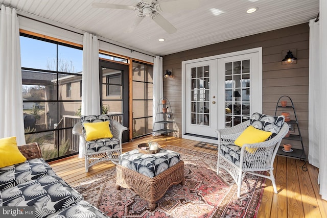 sunroom / solarium with french doors and ceiling fan