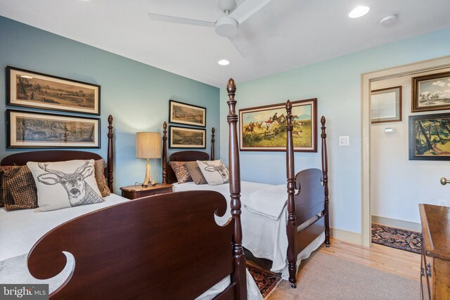 bedroom featuring ceiling fan and light wood-type flooring