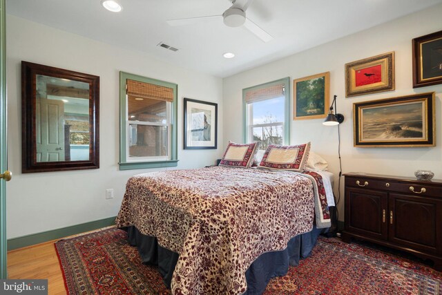 bedroom featuring hardwood / wood-style floors and ceiling fan