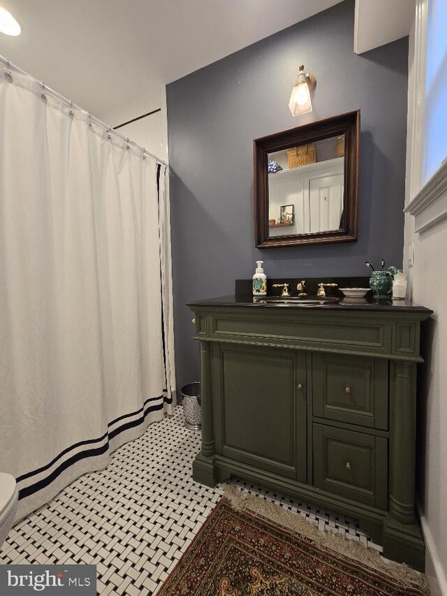 bathroom with vanity and toilet