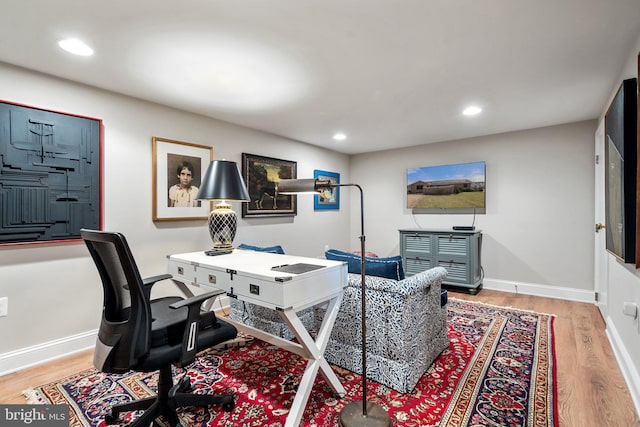 office space with light hardwood / wood-style flooring