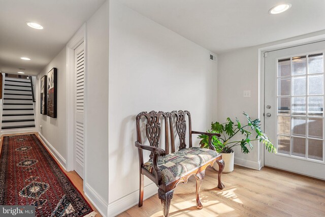 sitting room featuring a wealth of natural light and light hardwood / wood-style floors