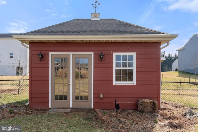 view of outbuilding featuring a lawn