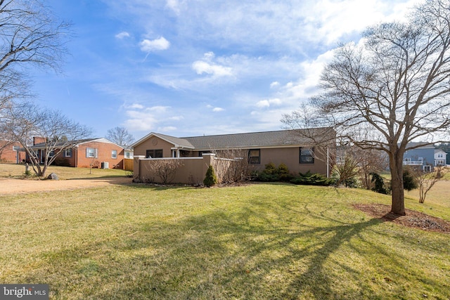 ranch-style house with a front yard