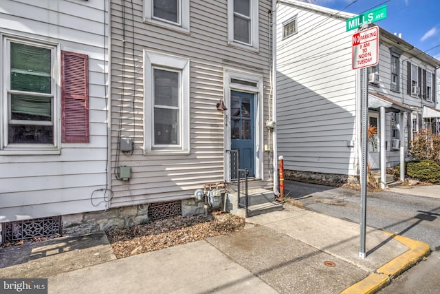 view of exterior entry featuring crawl space