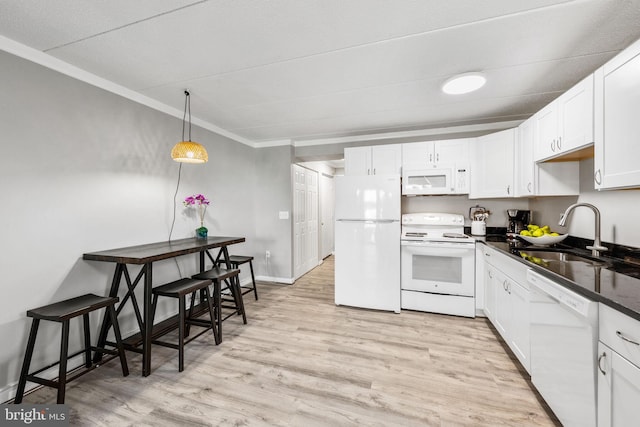 kitchen featuring sink, white cabinetry, crown molding, white appliances, and light hardwood / wood-style floors