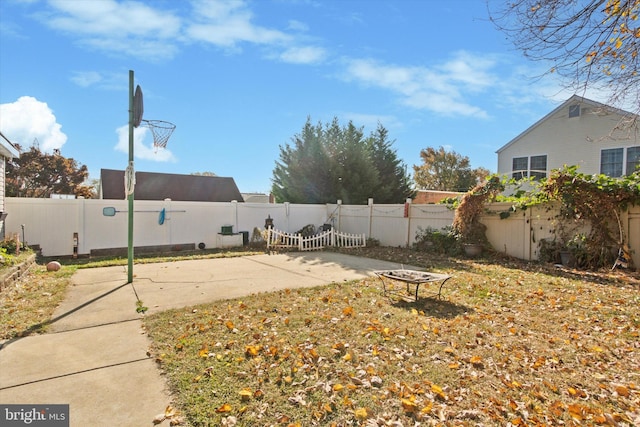 view of yard featuring a patio area and a fenced backyard