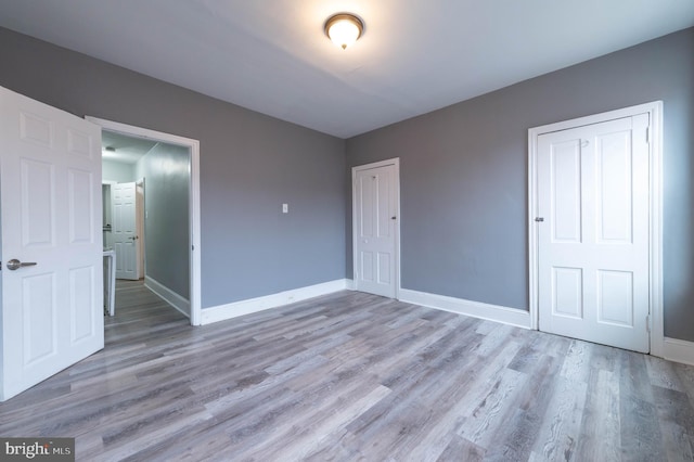 unfurnished bedroom with light hardwood / wood-style flooring