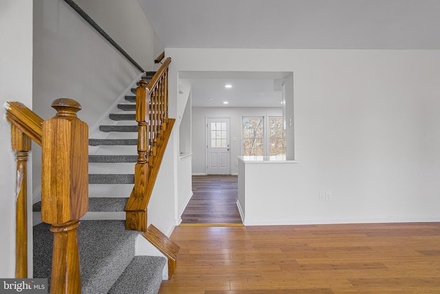 staircase featuring hardwood / wood-style flooring