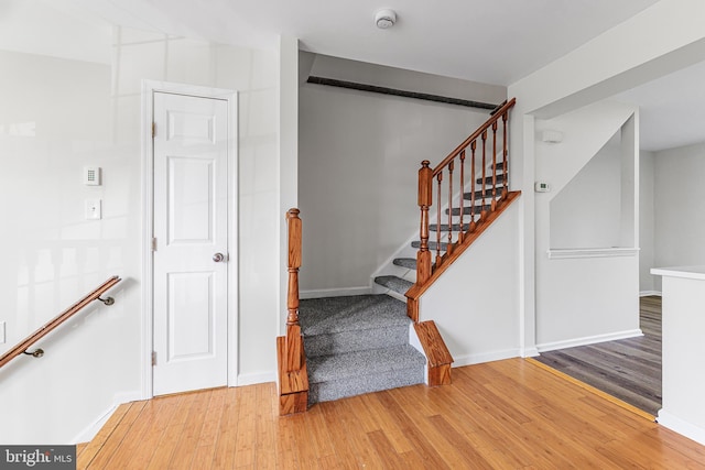 staircase featuring hardwood / wood-style floors