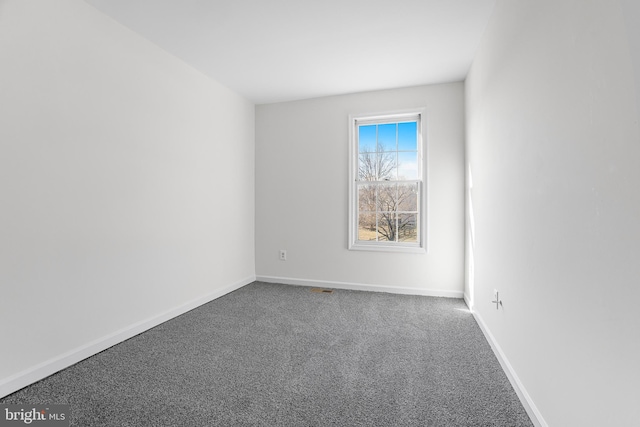 spare room featuring carpet flooring