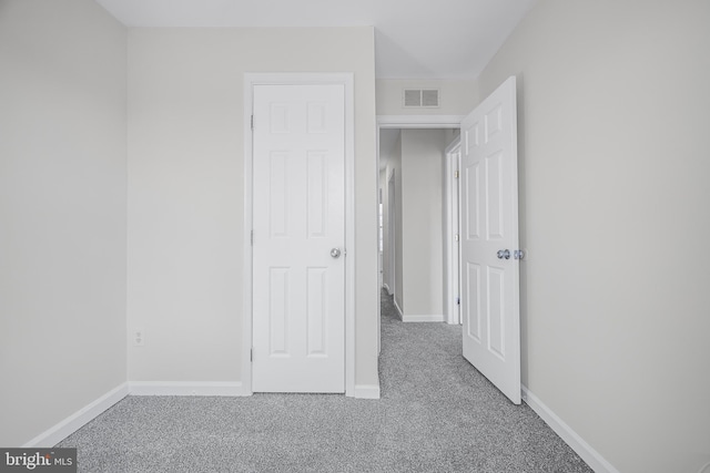 unfurnished bedroom featuring carpet flooring