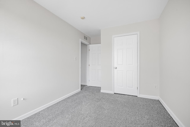 unfurnished bedroom with carpet flooring