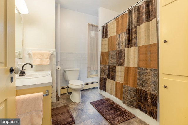 bathroom with vanity, a baseboard heating unit, tile walls, and toilet