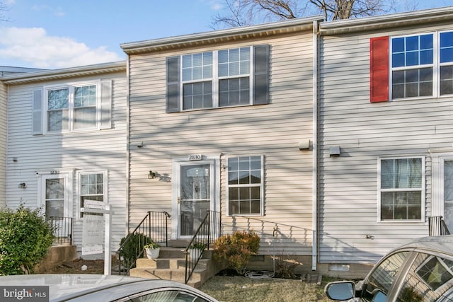 rear view of property featuring crawl space