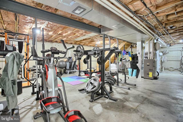 exercise area with heating unit and visible vents