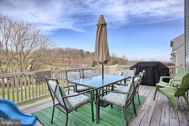 deck featuring outdoor dining space