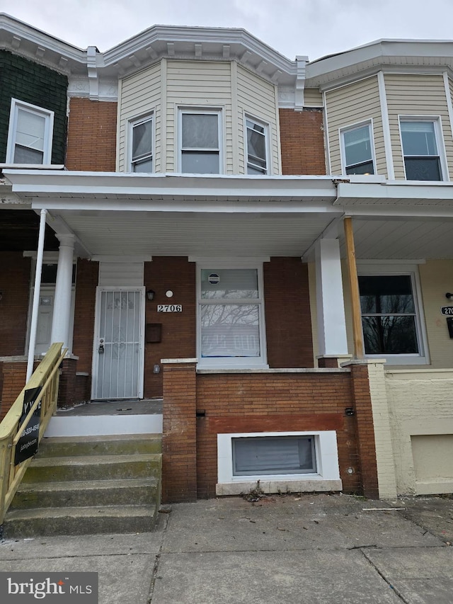 exterior space with brick siding