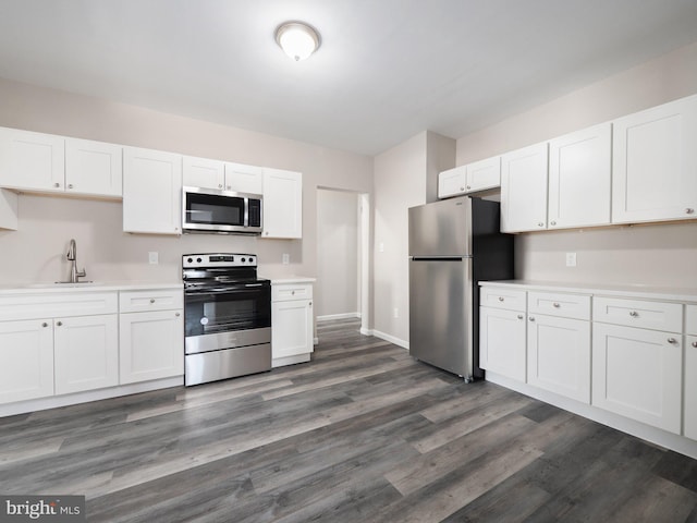 kitchen with white cabinetry, appliances with stainless steel finishes, and sink