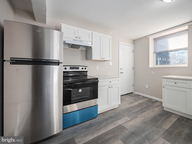 kitchen featuring stainless steel appliances, dark hardwood / wood-style flooring, and white cabinets