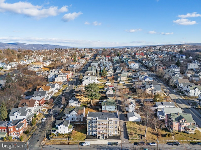 birds eye view of property with a mountain view