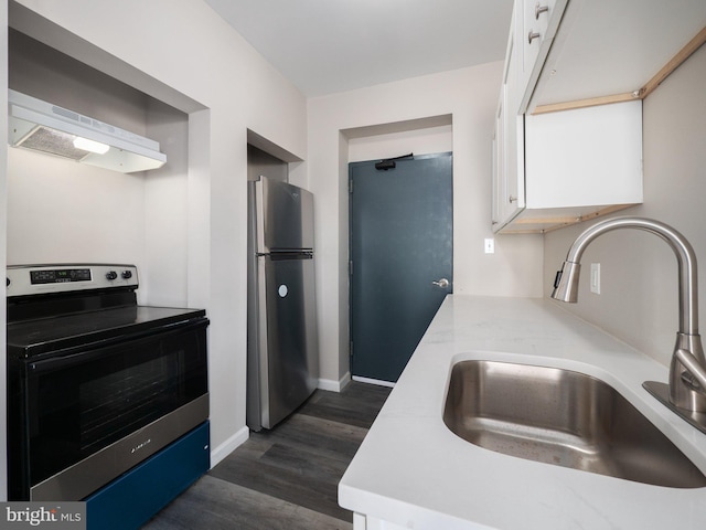 kitchen featuring white cabinetry, appliances with stainless steel finishes, dark wood-type flooring, and sink