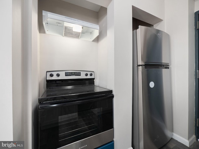 kitchen featuring ventilation hood and appliances with stainless steel finishes