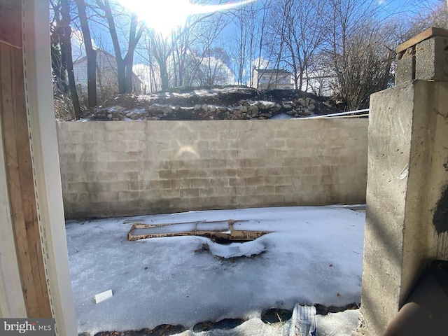 yard layered in snow with a mountain view