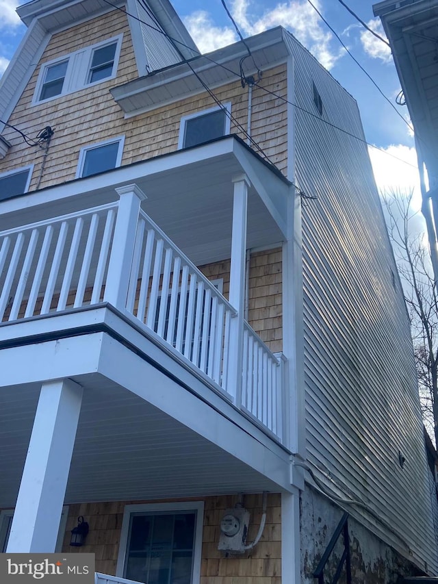 view of home's exterior with a balcony