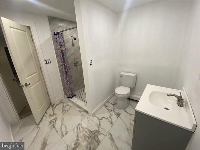 bathroom featuring vanity, curtained shower, and toilet