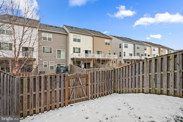 view of yard layered in snow