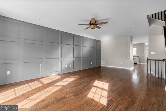 unfurnished living room with ceiling fan and wood-type flooring