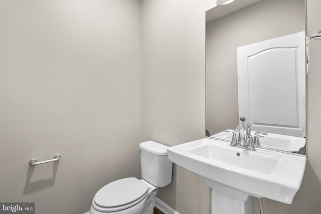 bathroom with sink and toilet