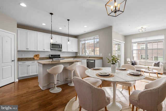 dining space with dark wood-type flooring