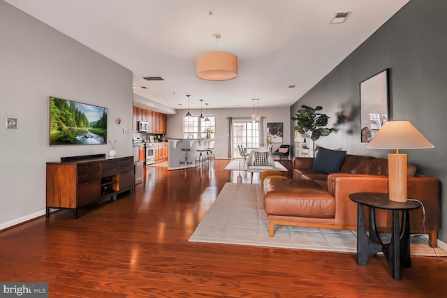 living room featuring dark wood-type flooring