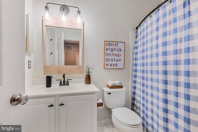 bathroom with vanity, toilet, and a shower with shower curtain