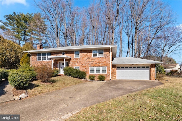 view of front of house with a garage and a front yard