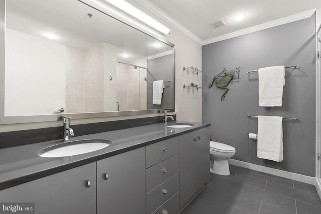 bathroom featuring ornamental molding, visible vents, a sink, and double vanity