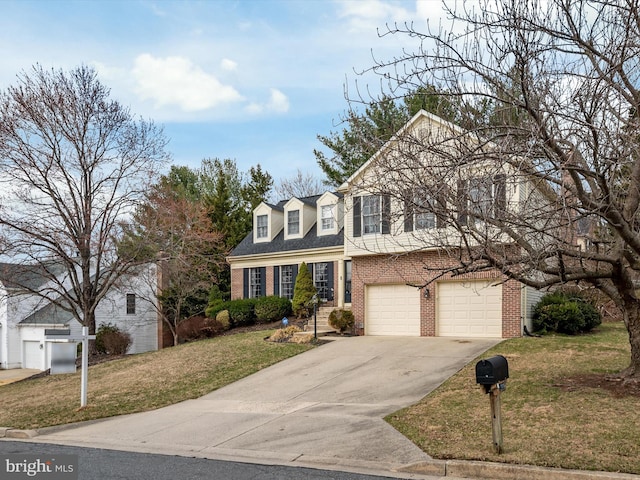 view of front of property featuring brick siding, an attached garage, concrete driveway, and a front yard