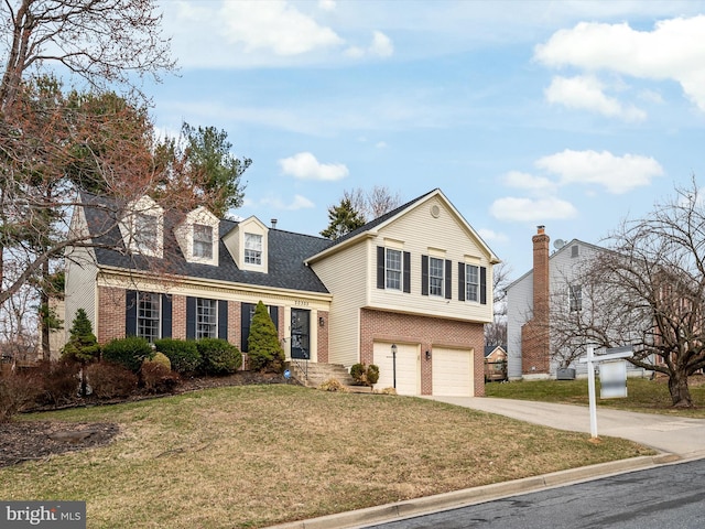 view of front of property featuring driveway, roof with shingles, a front yard, an attached garage, and brick siding