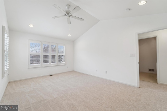 unfurnished room featuring lofted ceiling, carpet flooring, visible vents, and recessed lighting