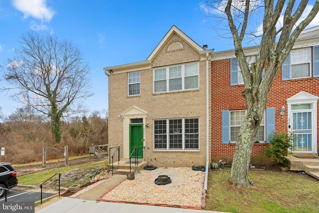 view of front of home with brick siding