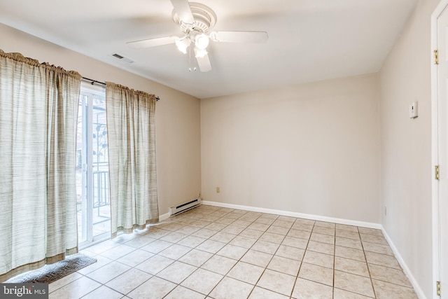 spare room featuring a baseboard radiator, light tile patterned flooring, and ceiling fan