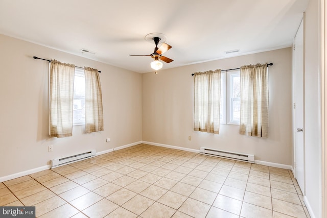 tiled spare room with a wealth of natural light, a baseboard radiator, and ceiling fan