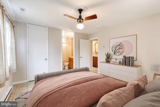 tiled bedroom featuring connected bathroom and a baseboard heating unit