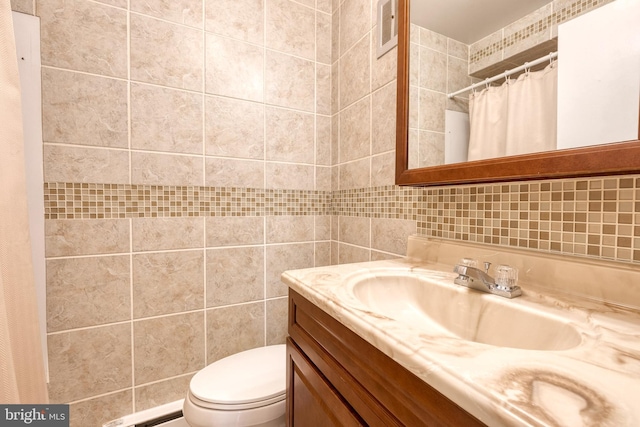 bathroom featuring vanity, a baseboard heating unit, tile walls, and toilet