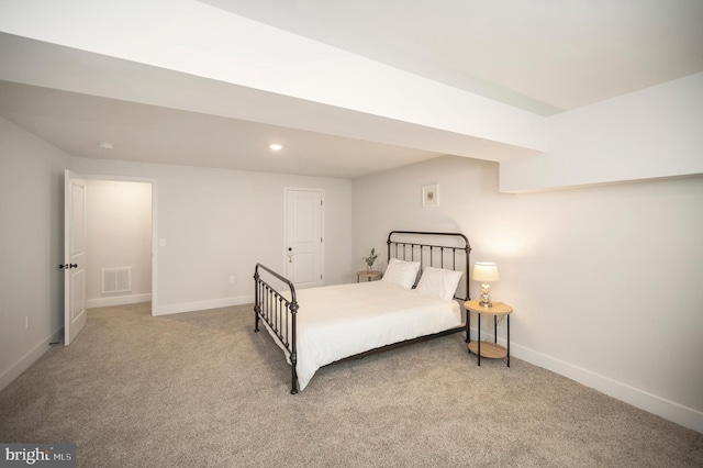 bedroom with light colored carpet