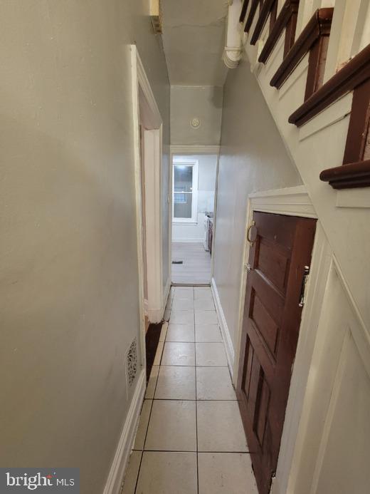 hallway with light tile patterned flooring