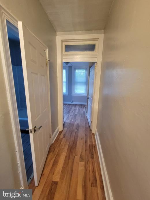 hallway featuring hardwood / wood-style flooring